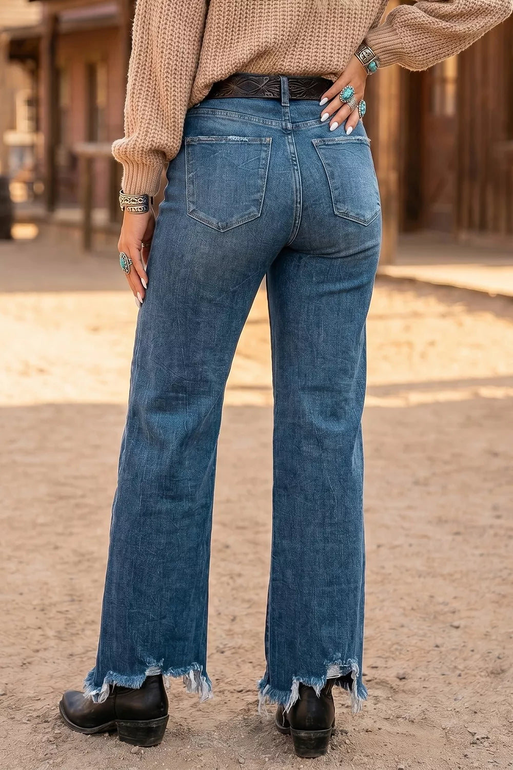 High-waist flare jeans, medium wash denim, frayed hem and back yoke