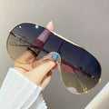 Aviator sunglasses with gold-tone frame and gradient blue-purple lenses