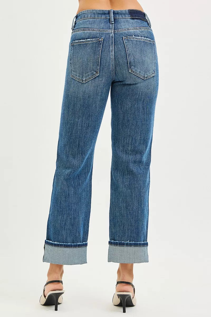 Dark blue straight-leg jeans with back pockets and cuffed hems
