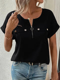 Black short-sleeve blouse with front zipper and snap pockets at chest