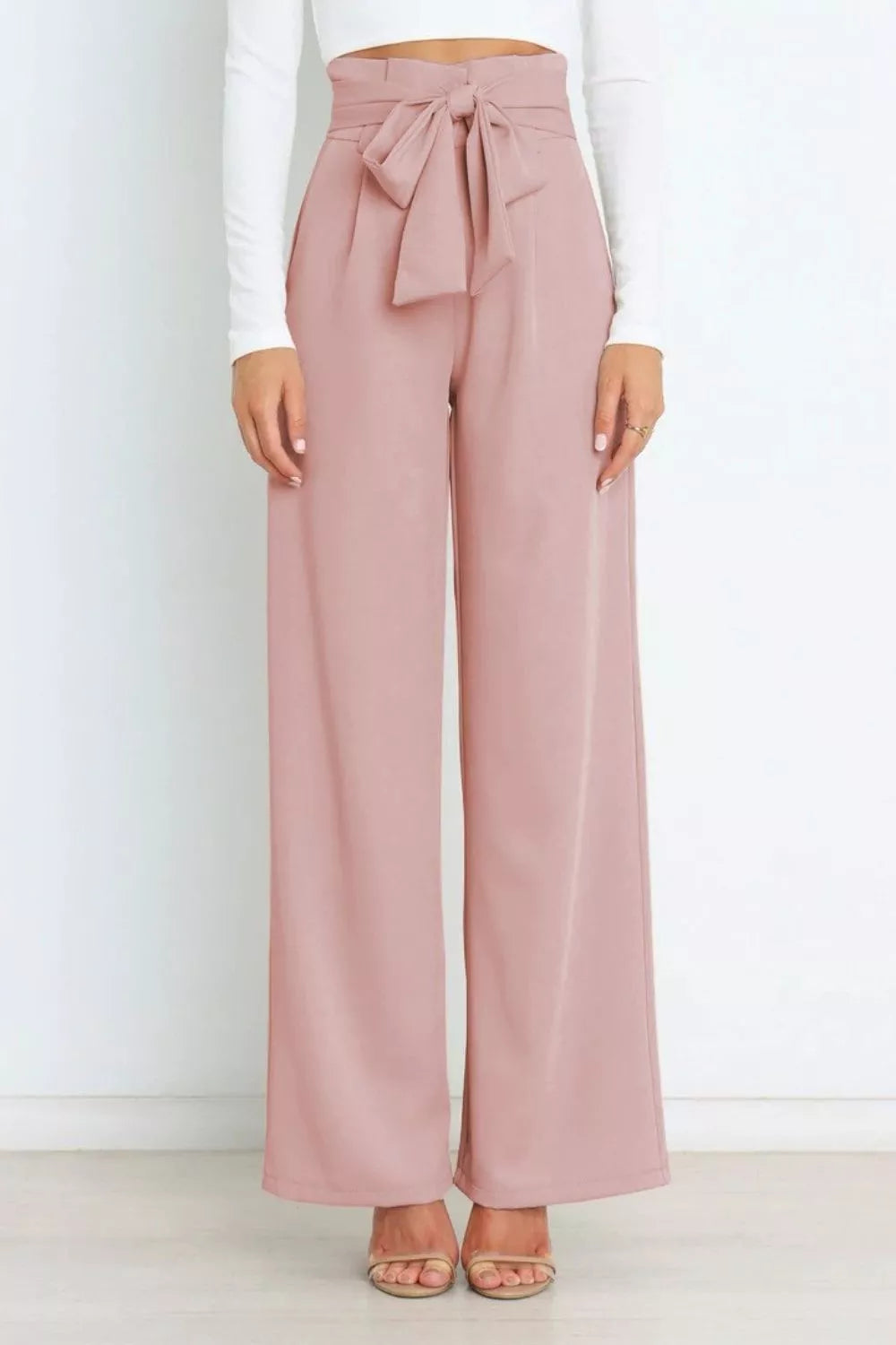 Blush pink high-waist tie-front wide-leg pants with gathered waistband and bow