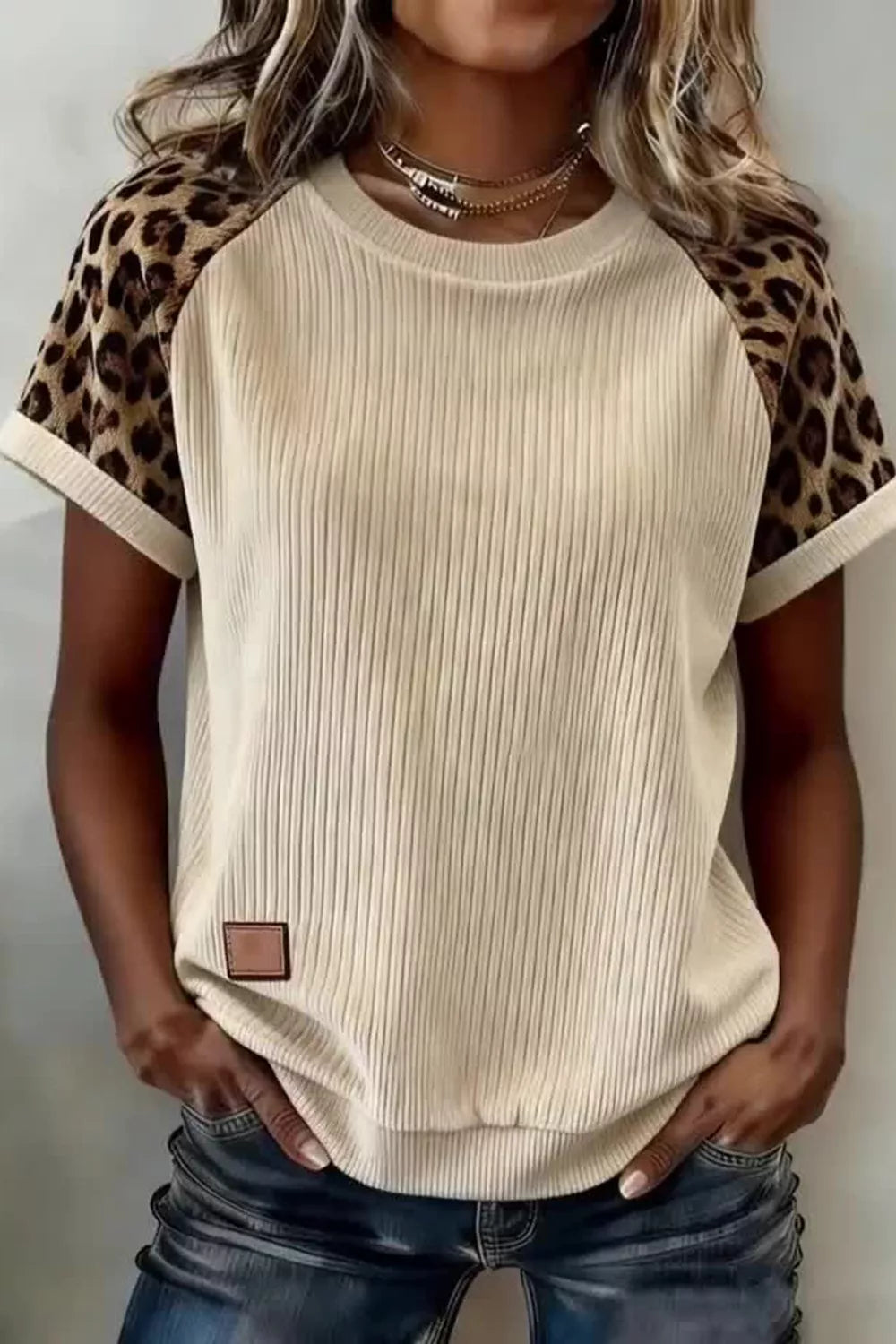 Beige ribbed loose tee with leopard contrast sleeves and round neckline