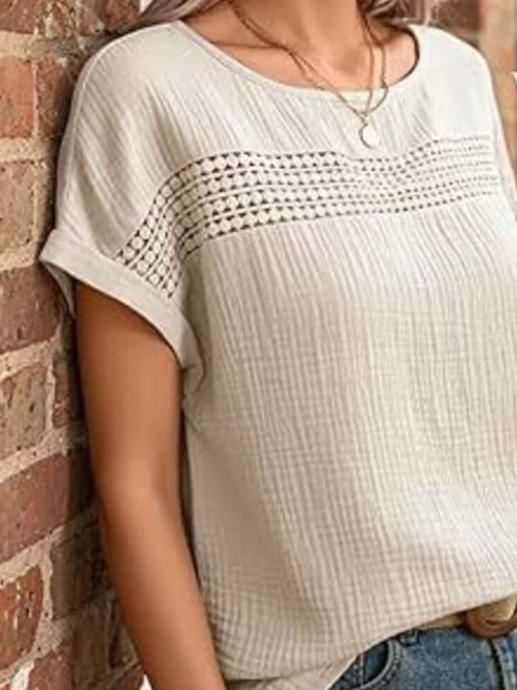 Tan lace-trimmed short-sleeve blouse with textured yoke, scoop neck