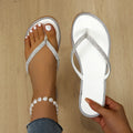 White rhinestone toe-post sandals with silver crystal border and V-shaped toe strap