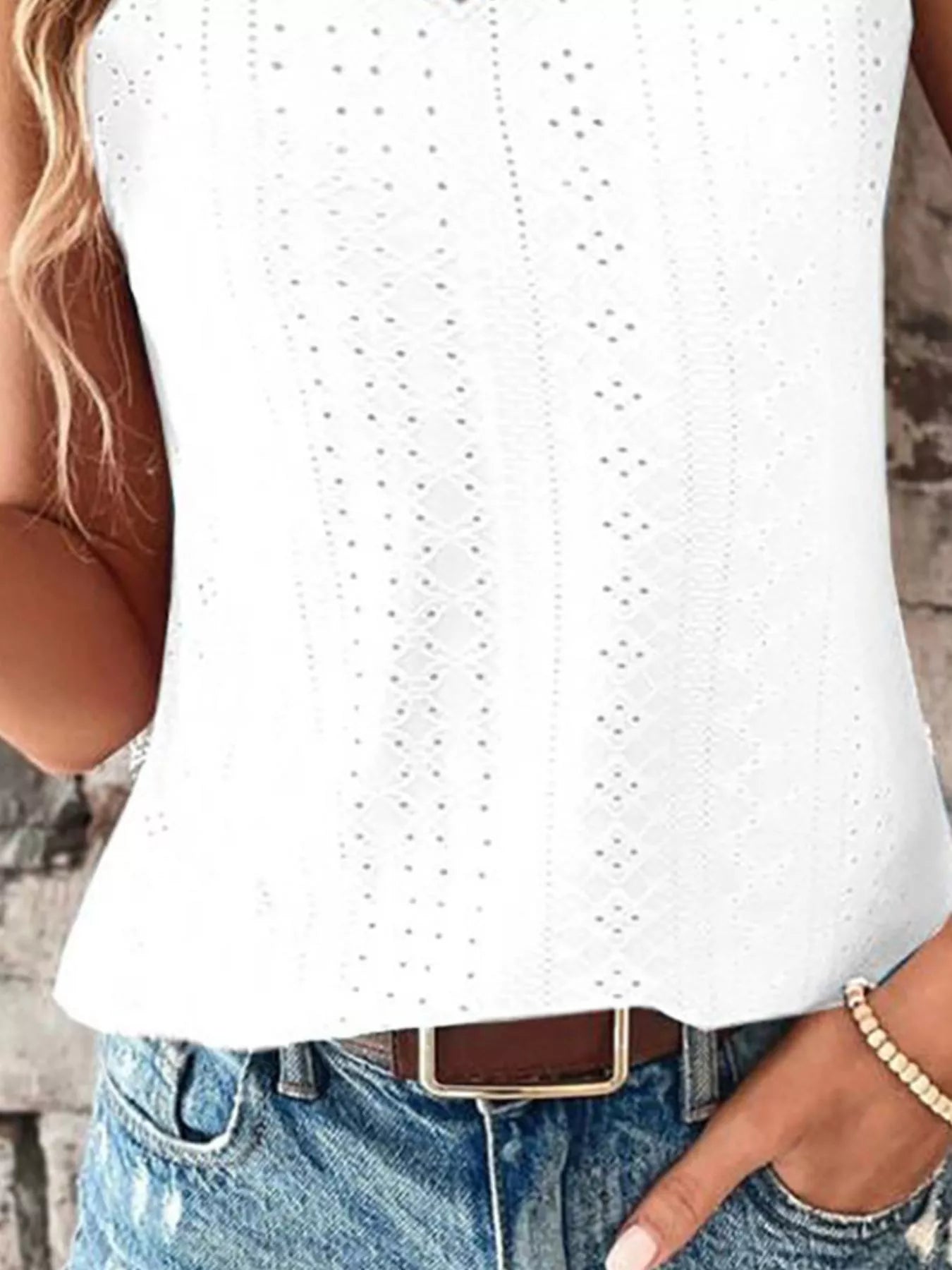 White eyelet lace V-neck tank top front with small cutout dot pattern and sleeveless hem.