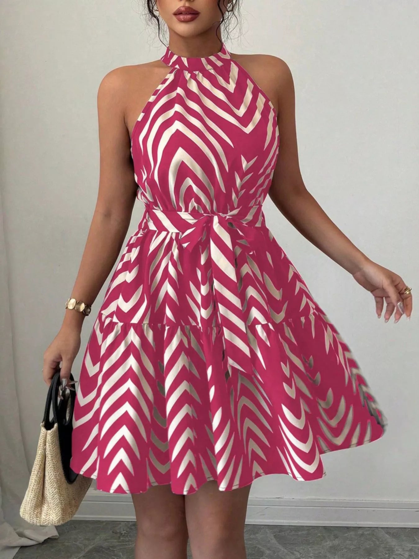 Rose red zebra-print halter dress with tie waist and ruffle hem, flared skirt