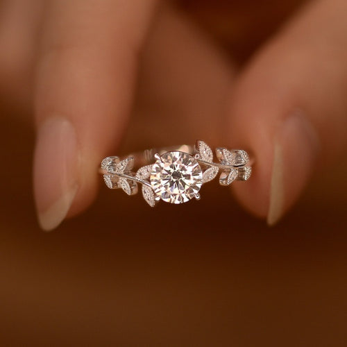 Silver 925 moissanite leaf ring with round center stone and leaf side accents