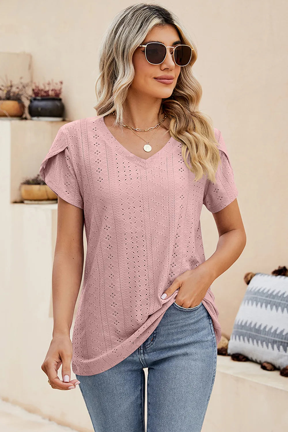 Blush pink eyelet V-neck T-shirt with petal sleeves and textured stitch detail
