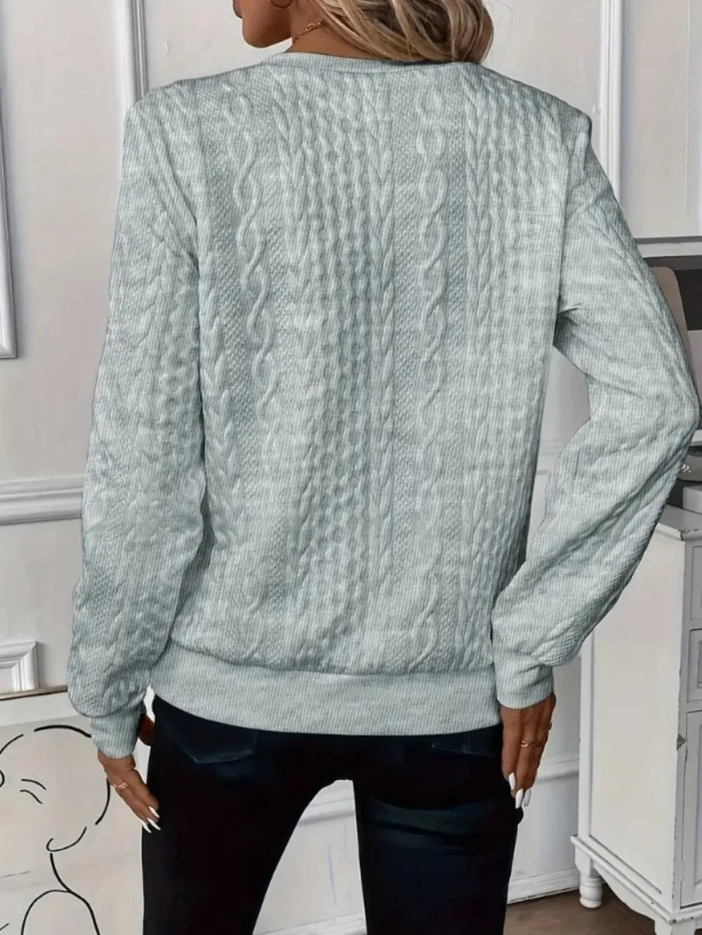 Back view of gray textured half-zip long-sleeve sweatshirt with ribbed waistband