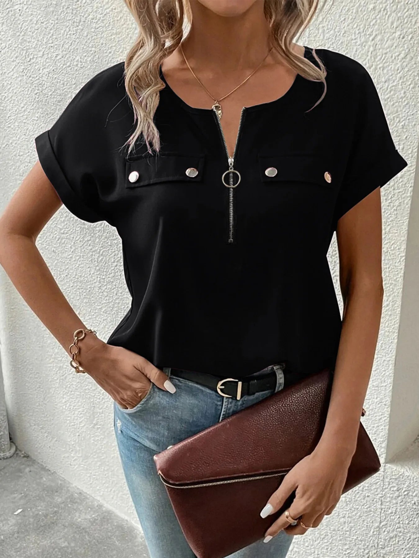 Black zipper front short sleeve blouse with chest snap buttons and round neckline