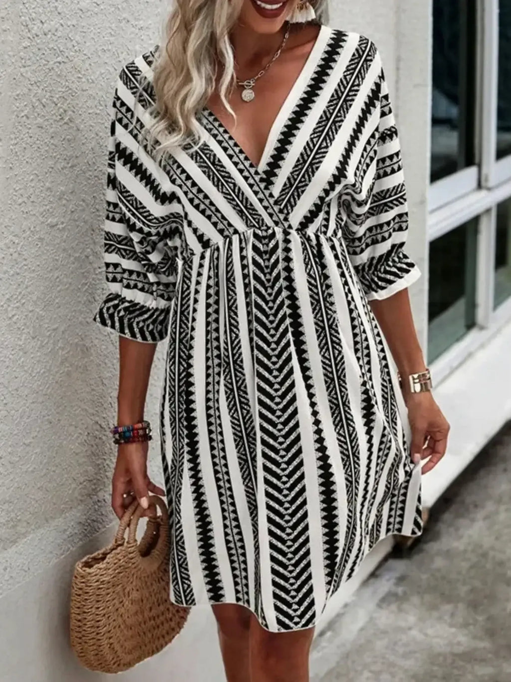 Geometric print V-neck mini dress, black-and-white vertical stripes, ruffled 3/4 sleeves