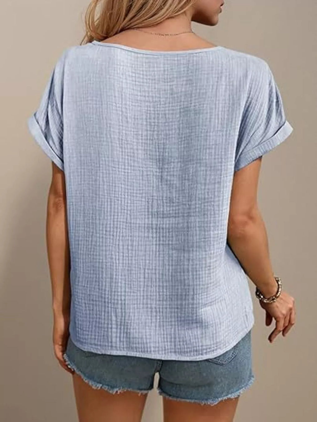 Light blue lace-trimmed short-sleeve blouse, back view with relaxed fit