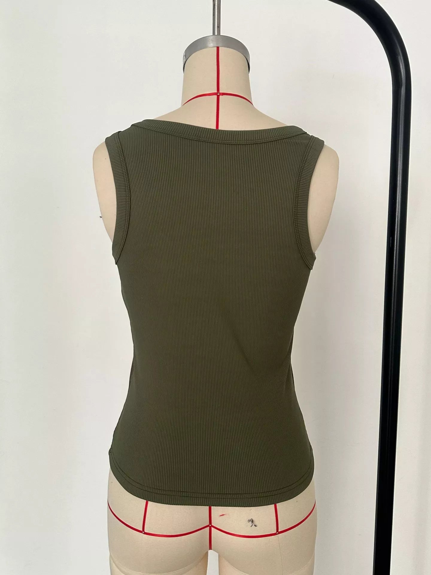 Army green ribbed knit slim-fit tank, scoop back view on mannequin