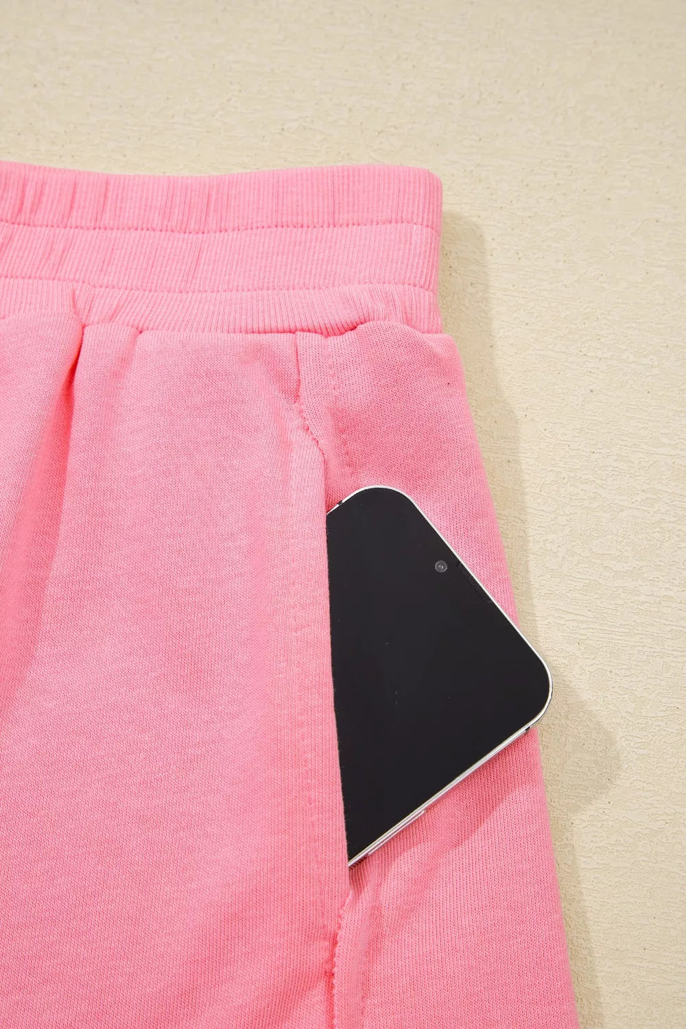 Dusty pink skort with side pocket opening and elastic waistband