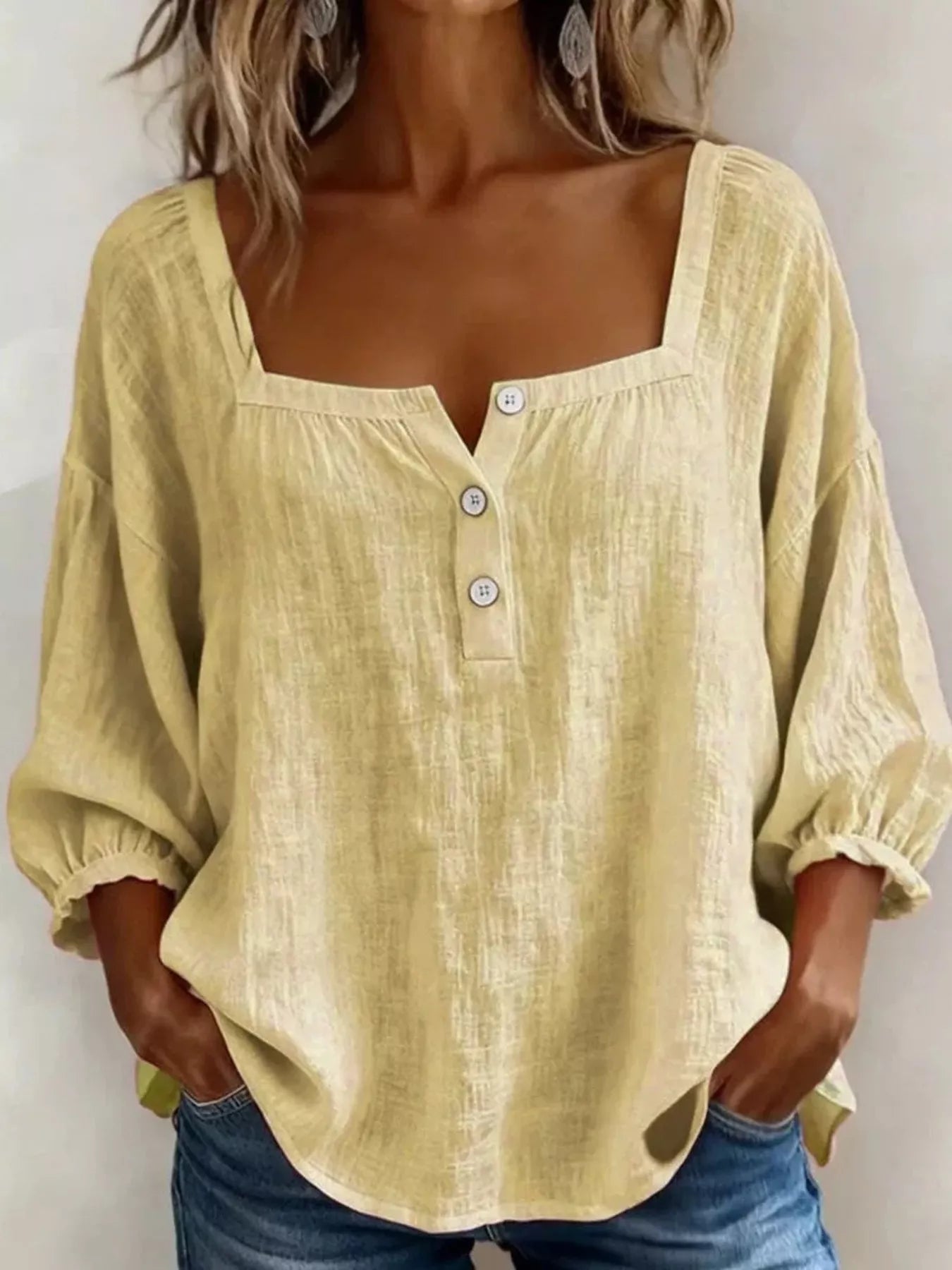 Yellow square-neck button-detail blouse with puff sleeves and gathered cuffs