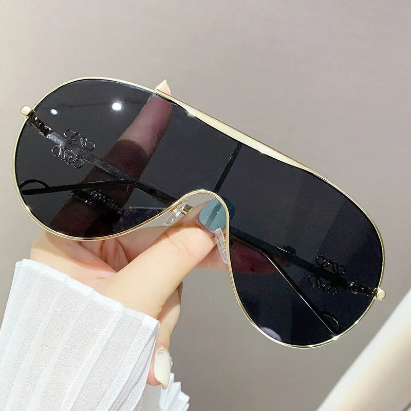 Aviator sunglasses with gold-tone frame and gradient dark lenses