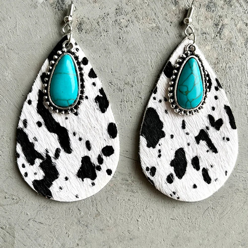 Cow print teardrop earrings with turquoise stone and silver bead trim, dangling hooks
