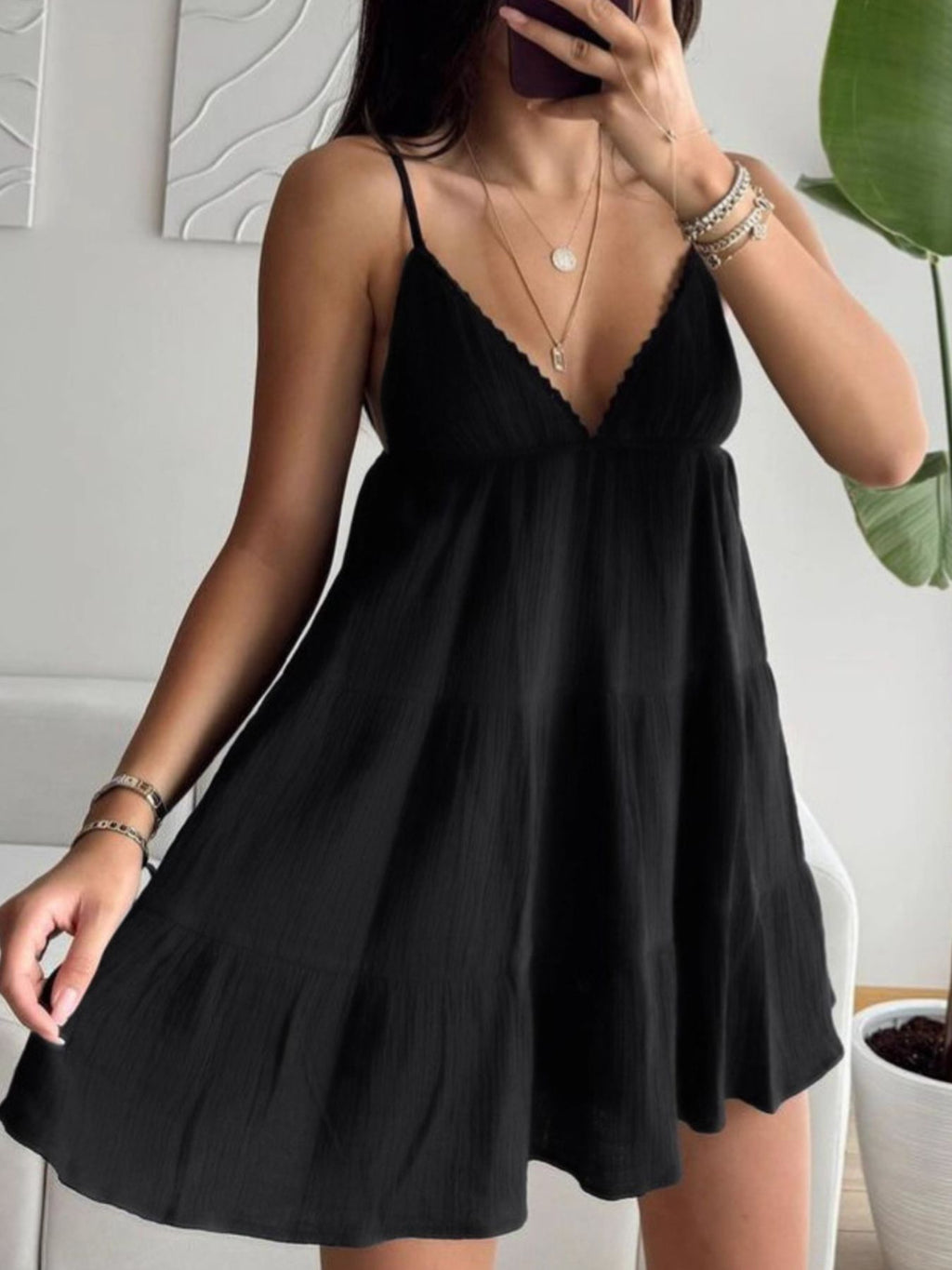 Black V-neck tiered mini dress with scalloped lace straps and tiered flared skirt