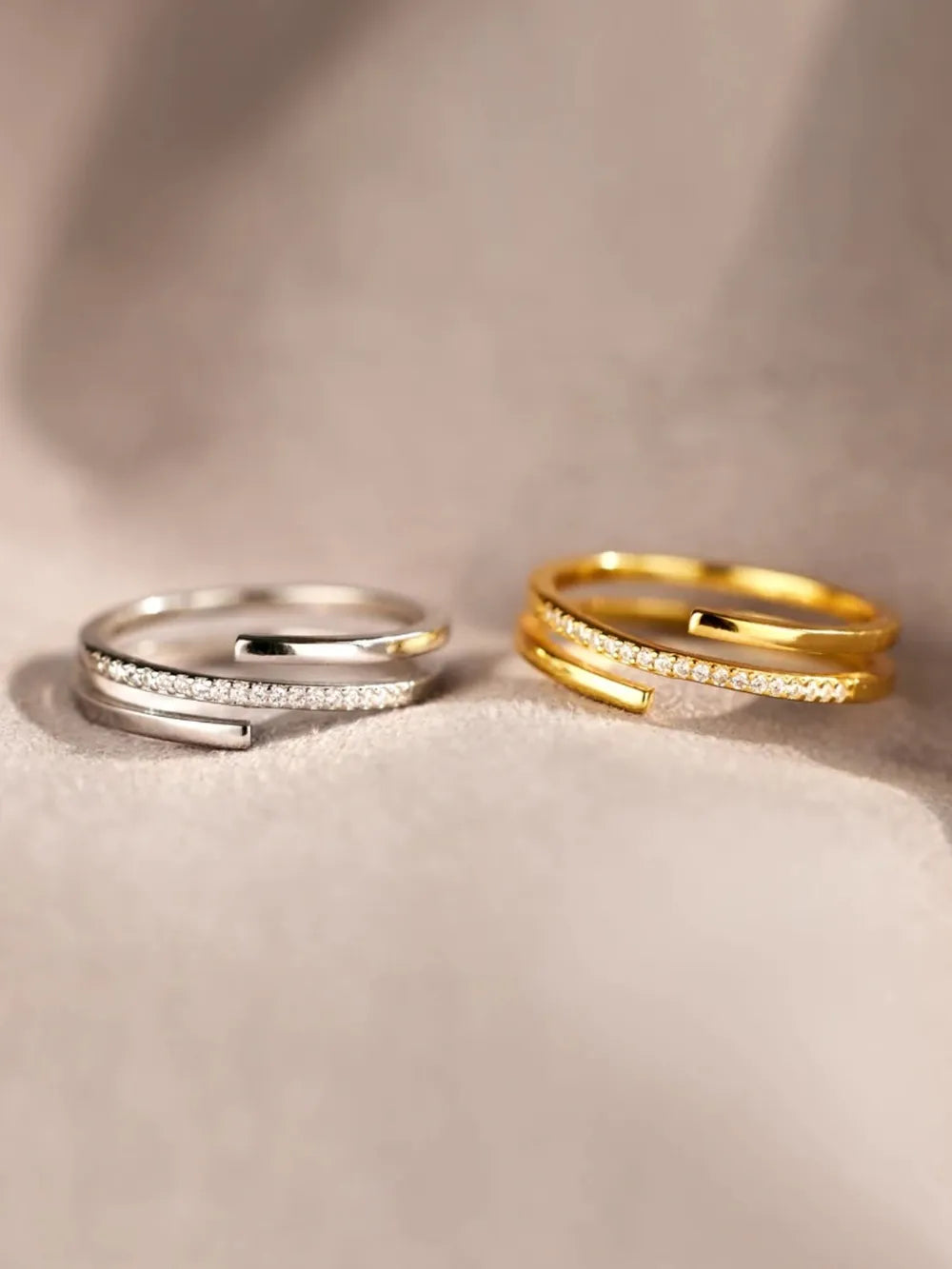 Gold and silver zircon inlay rings with slim bands, embedded stones, and rectangular cutouts