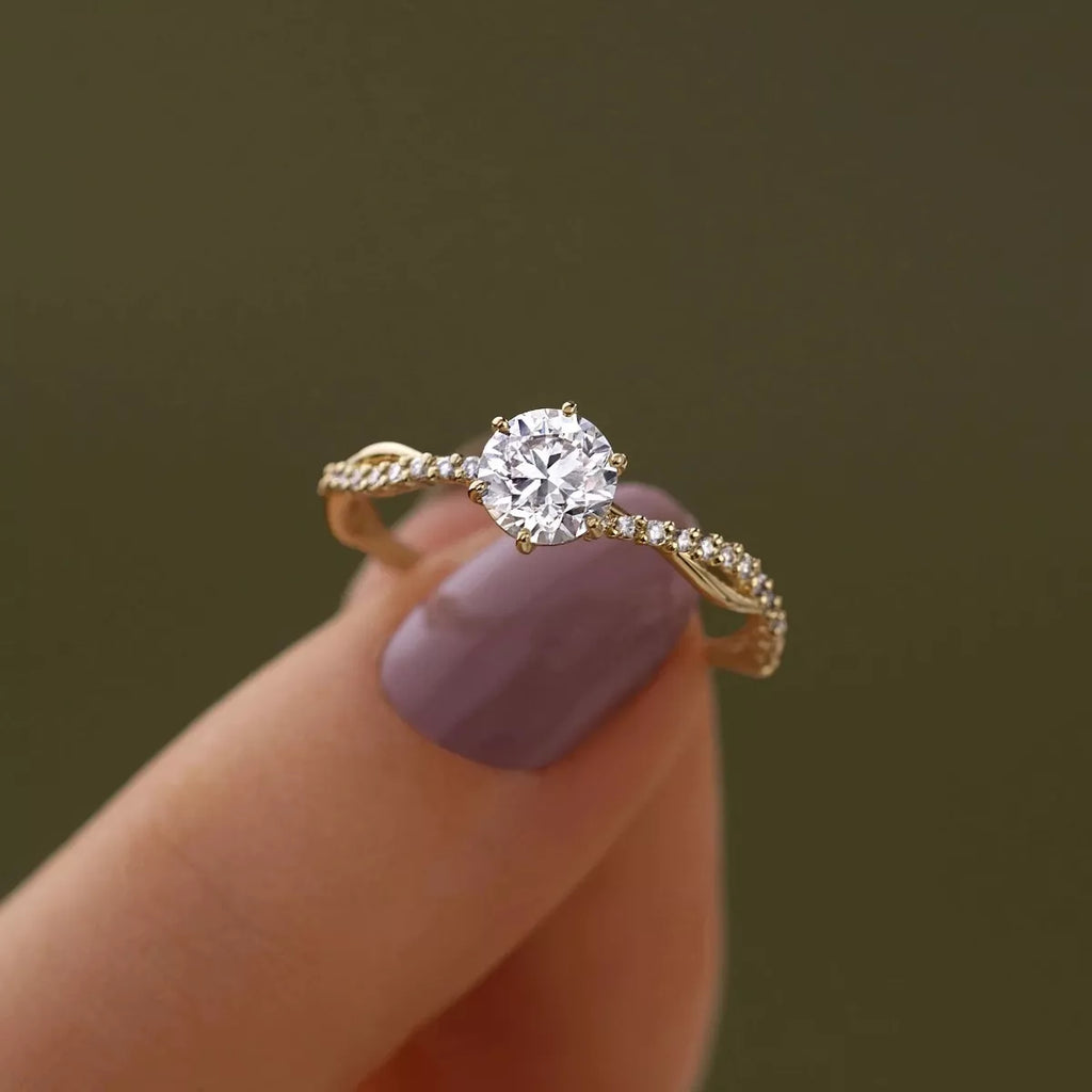 Gold-tone 925 sterling silver zircon ring with round center stone and curved pavé accents