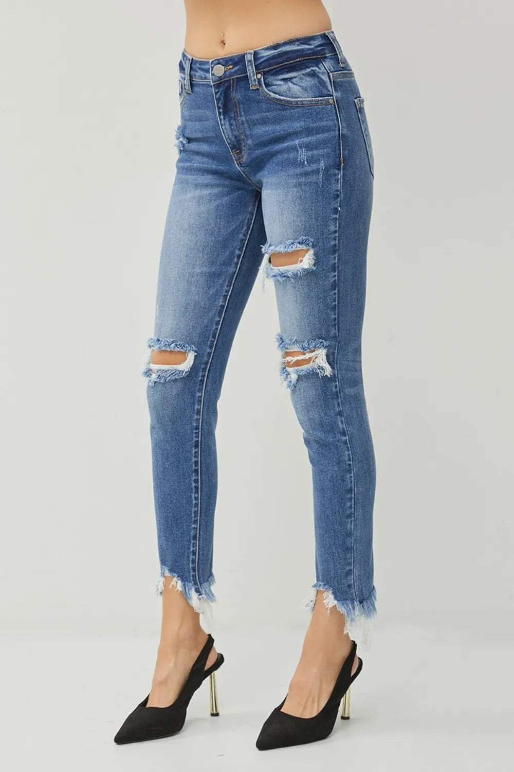 Dark blue slim jeans with thigh rips and frayed ankle cuffs
