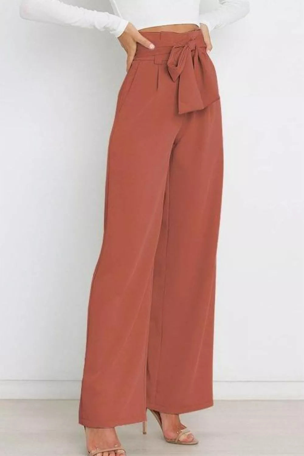 Brick red high-waist tie-front wide-leg pants with waist tie bow and long wide legs