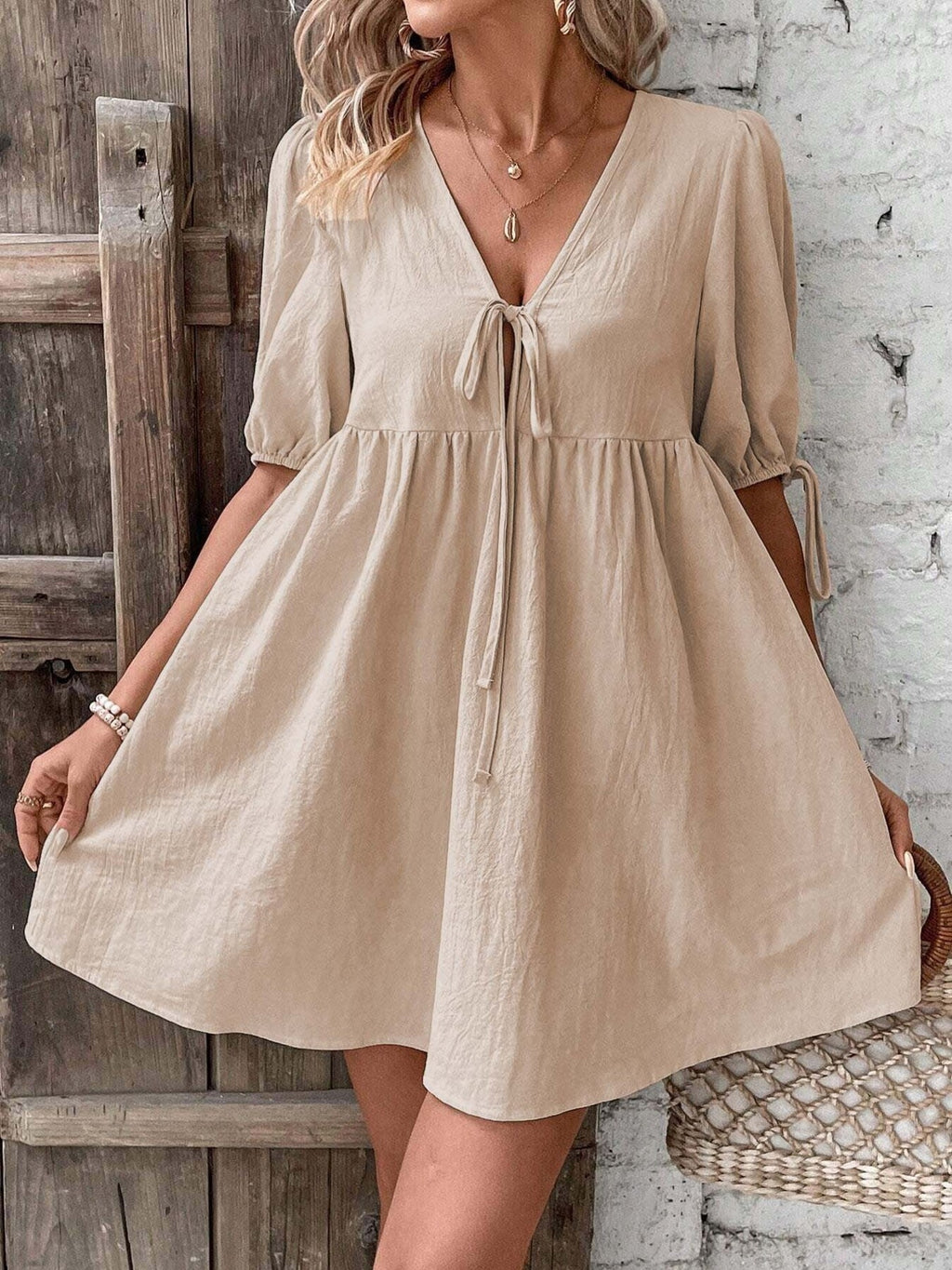 Khaki puff sleeve mini dress with deep V tie-front and tiered gathered skirt