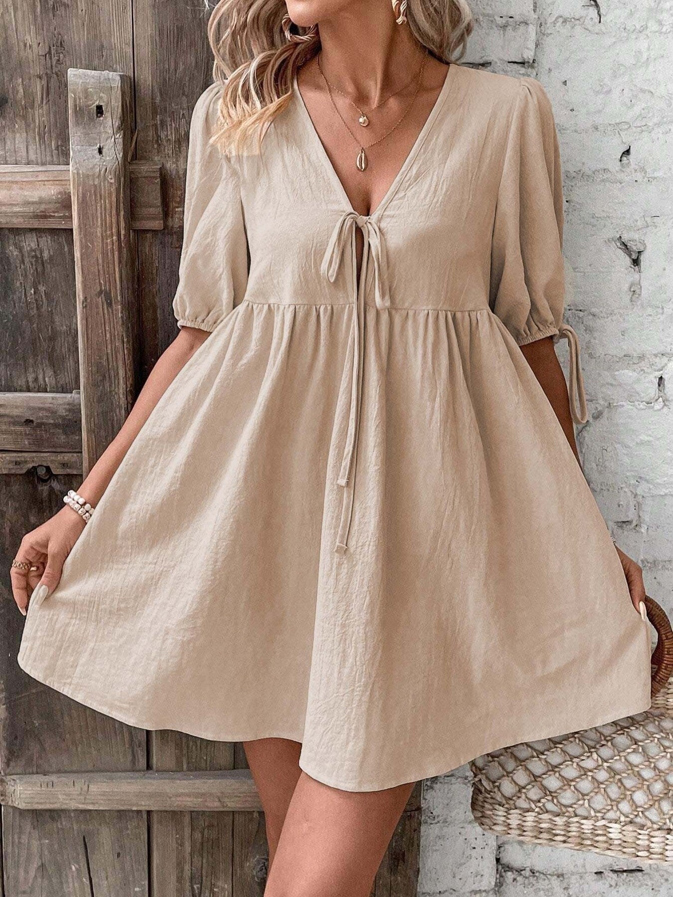 Khaki puff sleeve mini dress with deep V tie-front and tiered gathered skirt