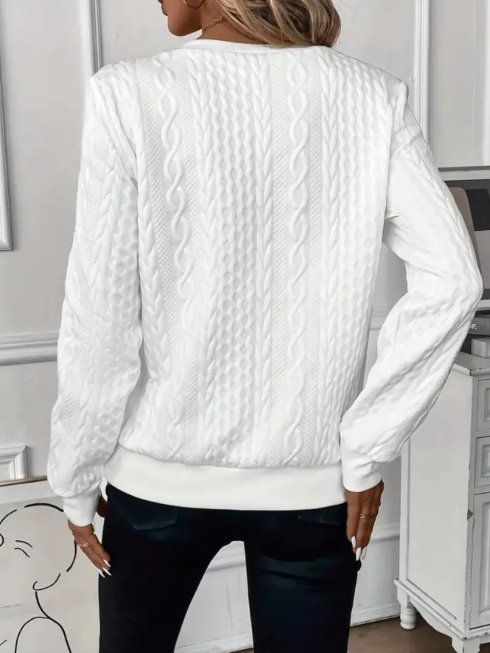 Back view of white textured half-zip long-sleeve sweatshirt, ribbed waistband