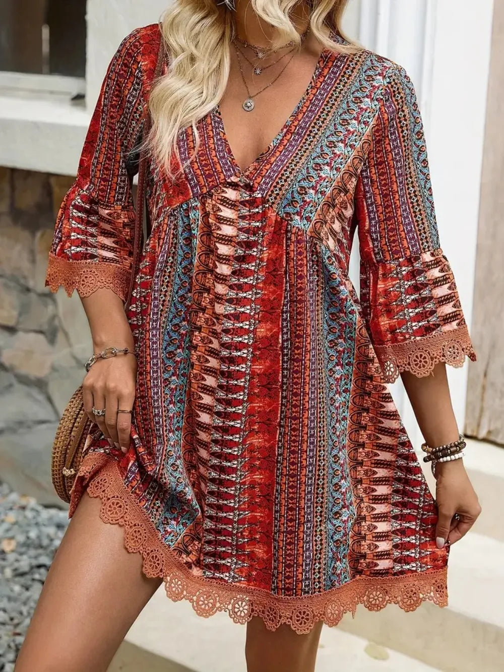 Rust printed V-neck mini dress with lace-trimmed sleeves and corset front