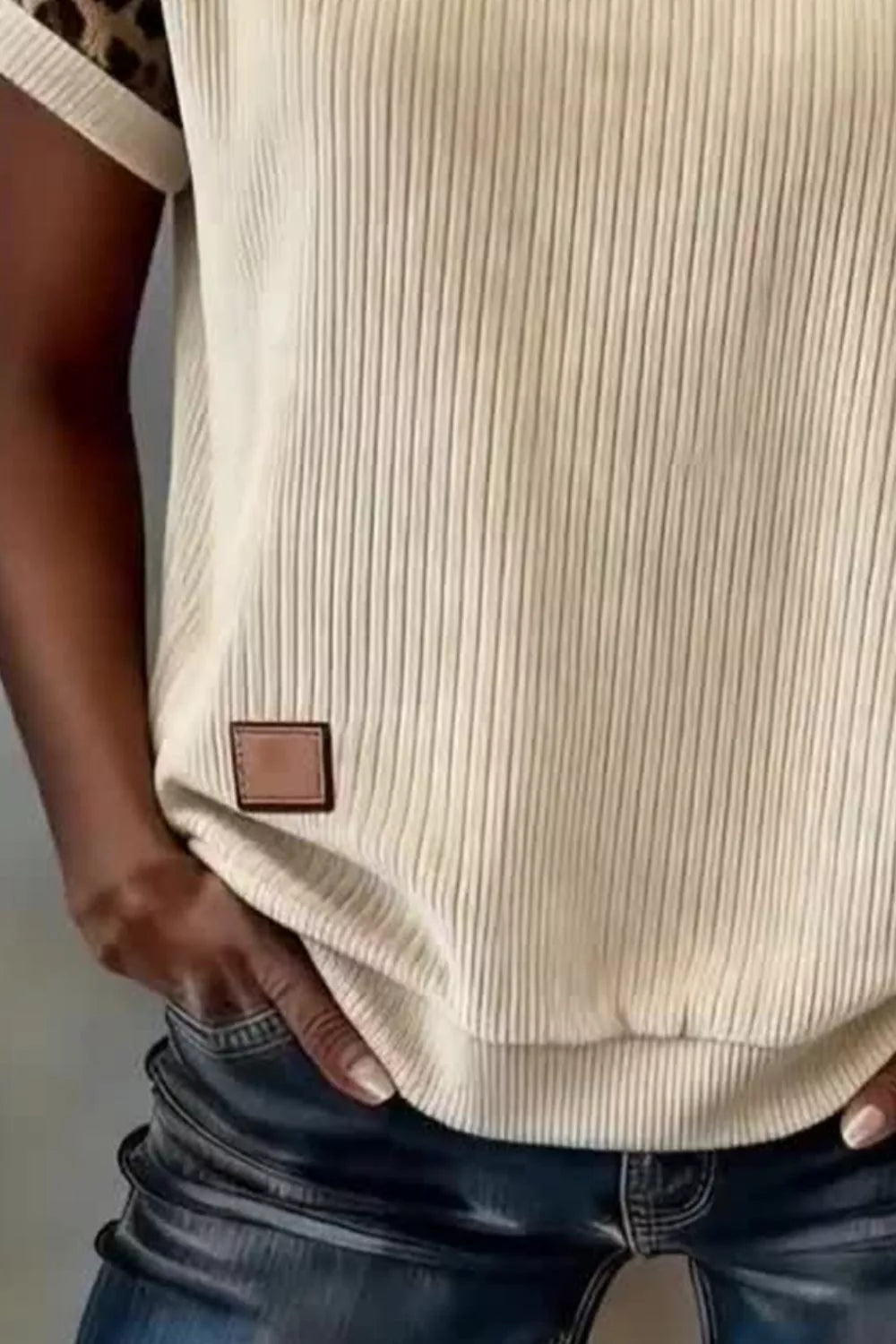 Beige ribbed loose tee with leopard contrast sleeve cuff and small square patch