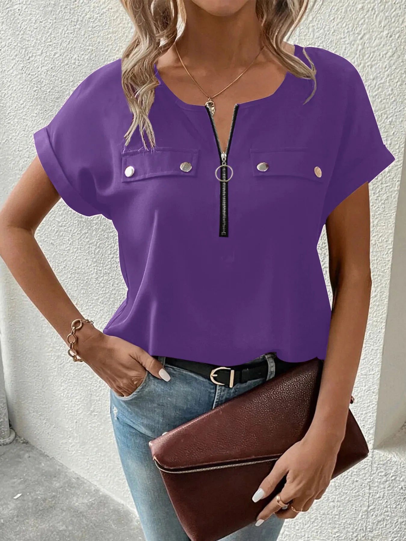 Purple short-sleeve zip blouse with chest button pockets and split neckline