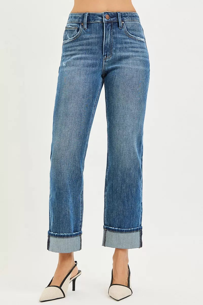 Dark blue high-rise button-fly jeans with cuffed hems and five-pocket styling