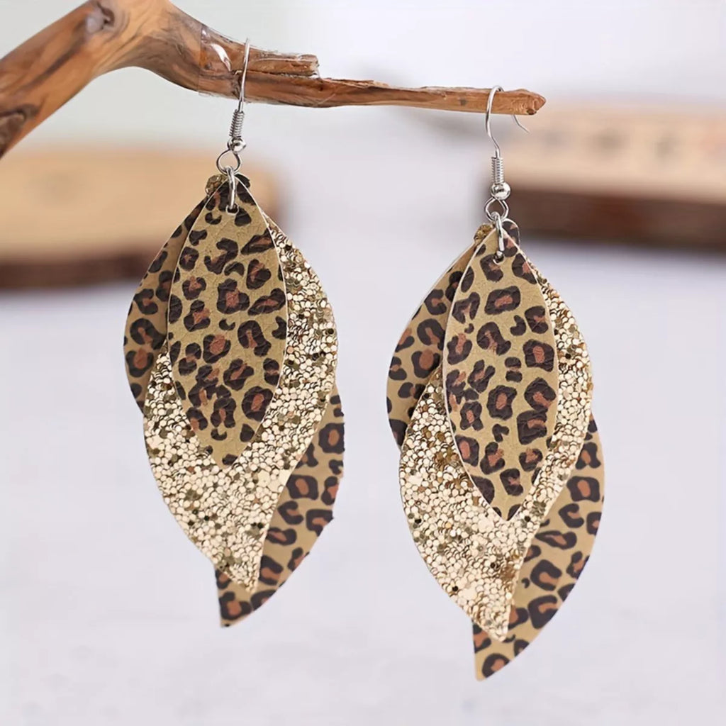 Gold-tone leopard print leaf drop earrings with glitter inset and fishhook backs
