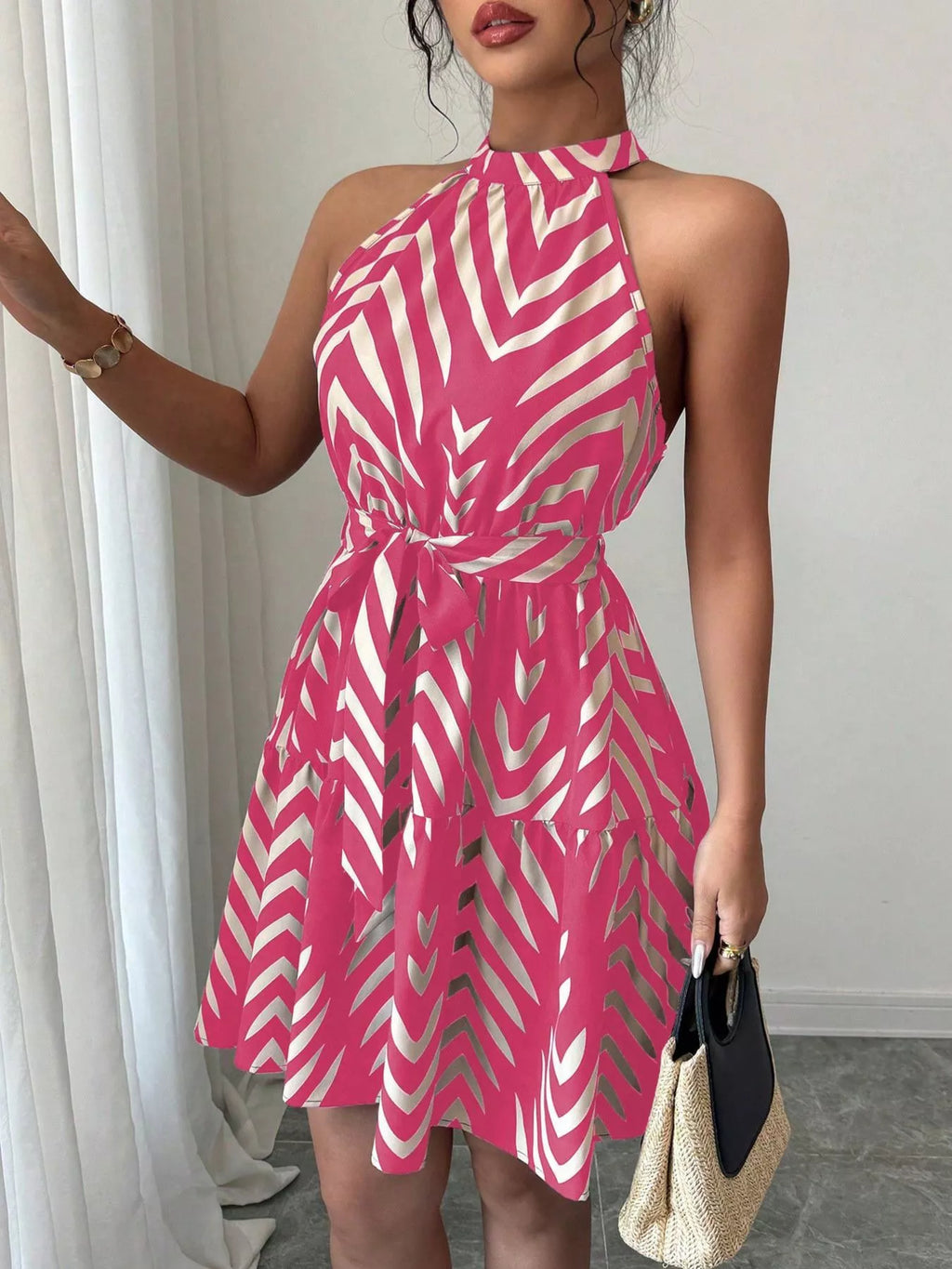 Rose red zebra-print halter dress with tie waist and ruffle hem, fitted bodice and flare