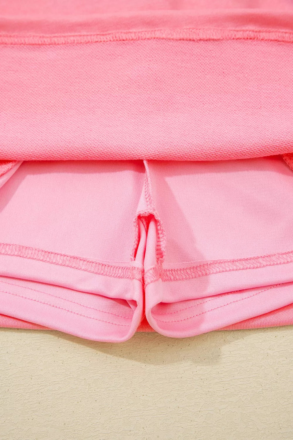 Dusty pink skort pocket opening with stitched side seam