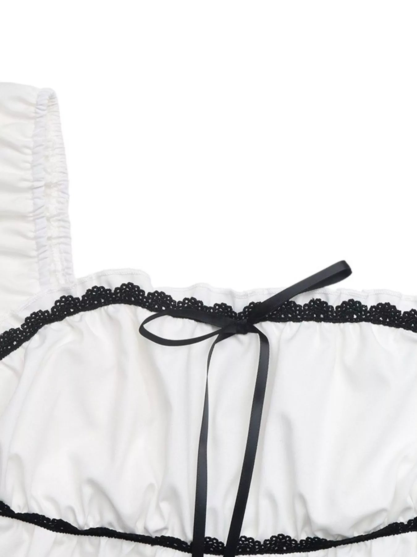 White blouse neckline with black lace trim and ribbon bowknot detail