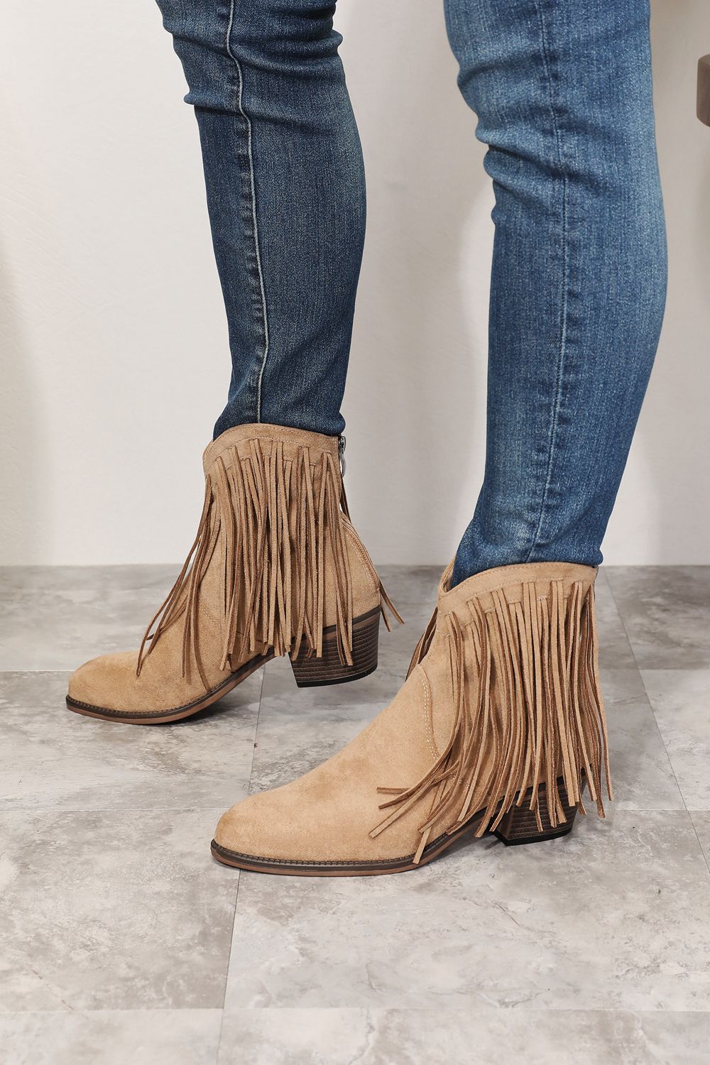 Khaki suede cowboy ankle boots with long fringe and mid-height heel