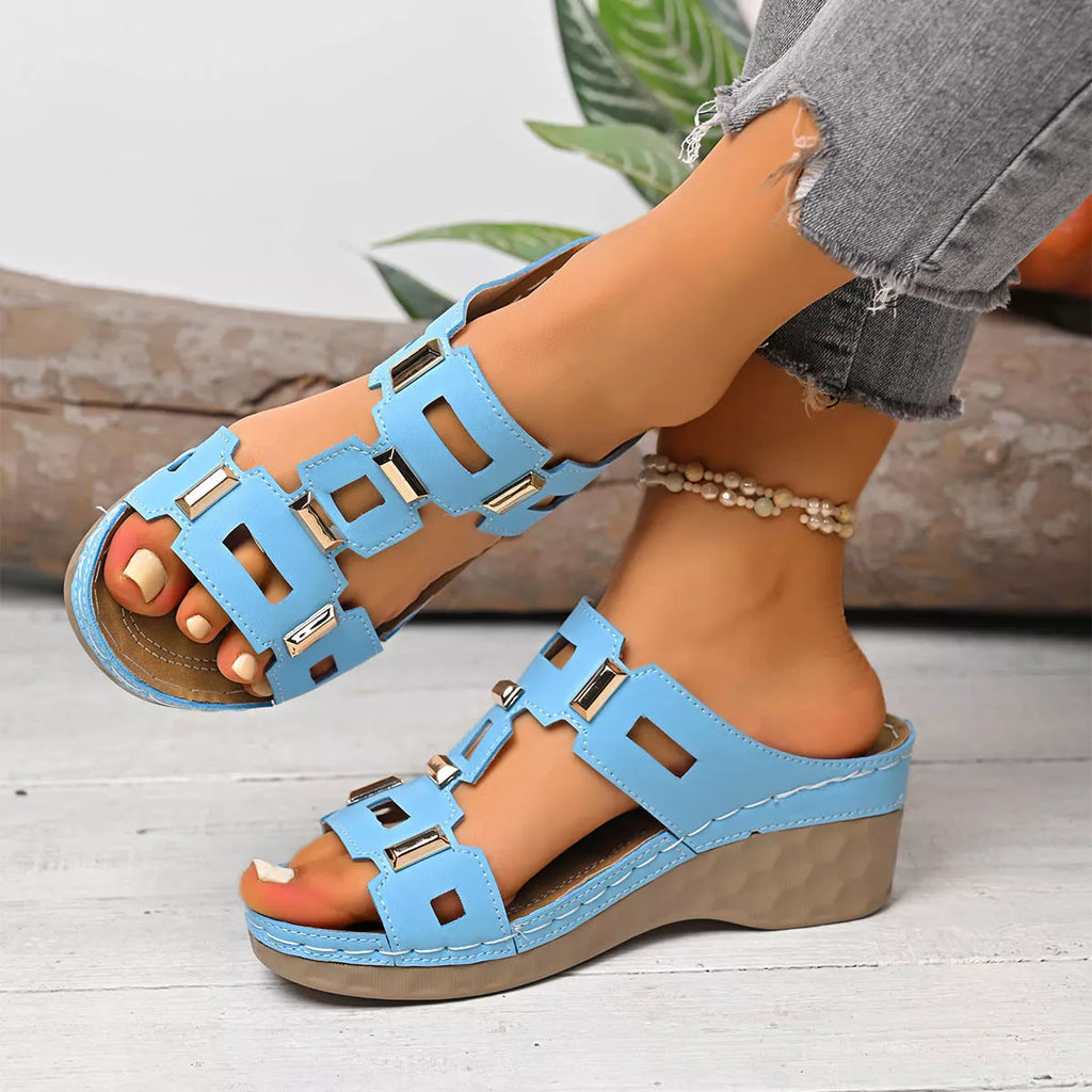 Open-toe wedge sandal in sky blue with open toe, crisscross straps, and wedge heel