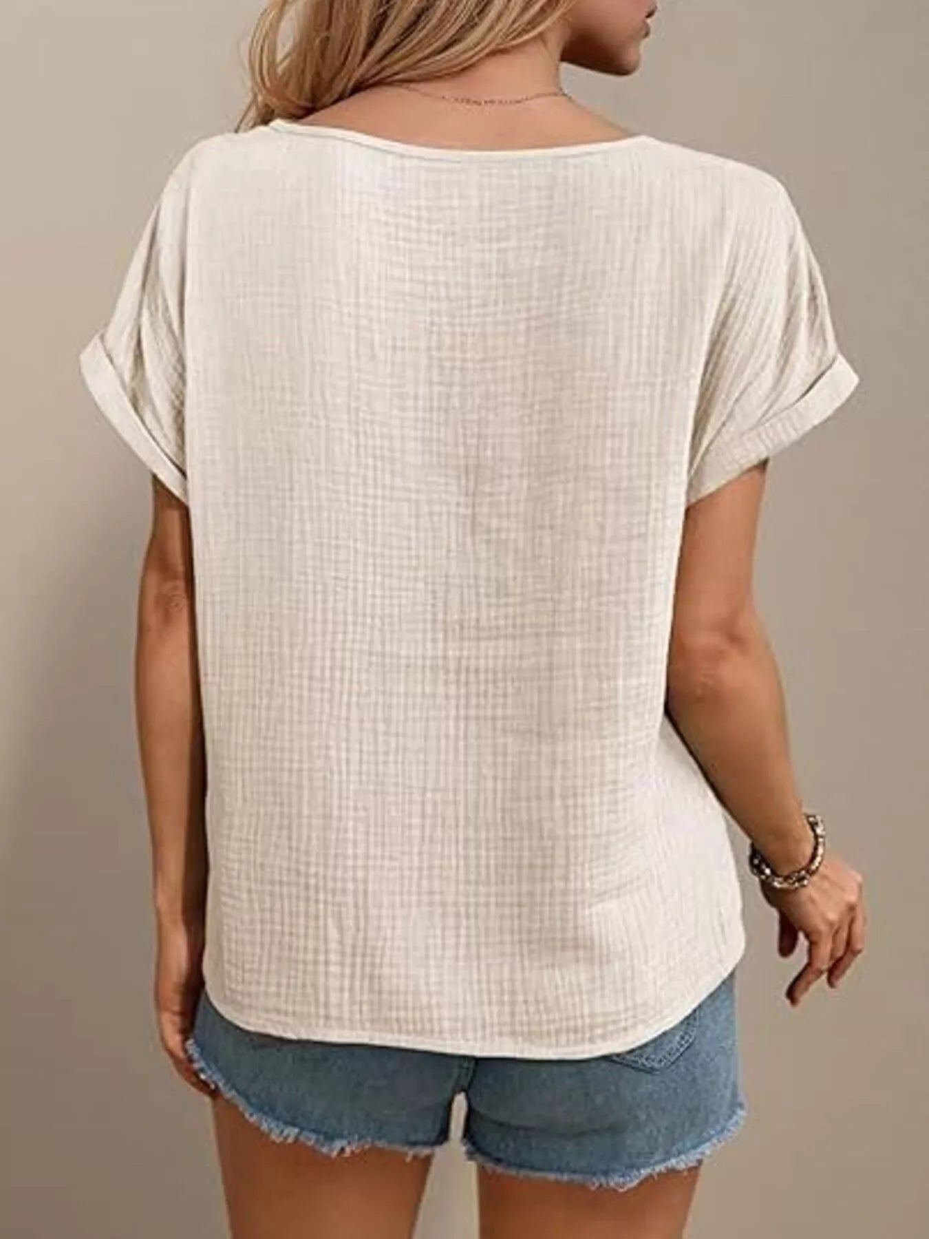 Tan lace-trimmed short-sleeve blouse, back view with relaxed fit