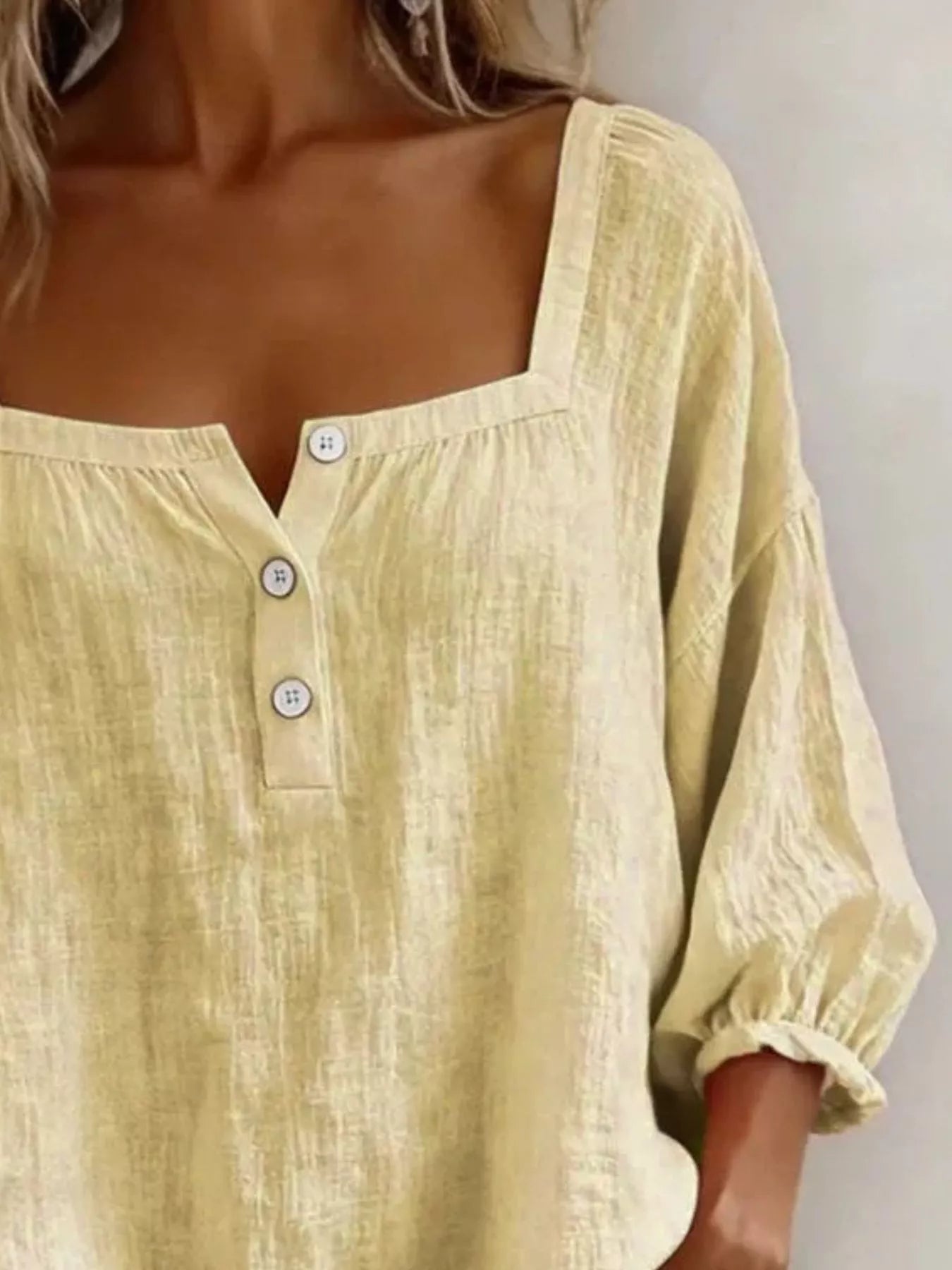 Yellow square-neck button-detail blouse with partial front buttons and puff sleeves