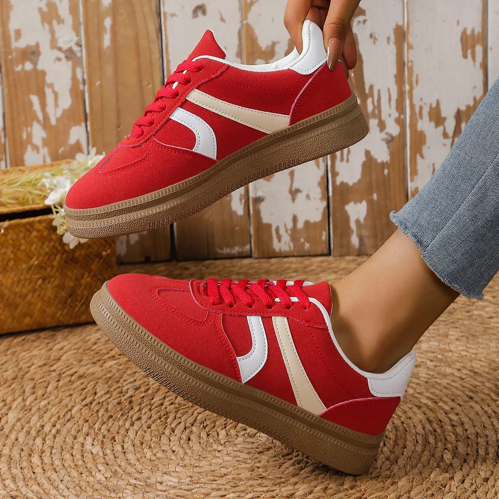 Red and white platform sneakers with lace-up front and brown textured sole