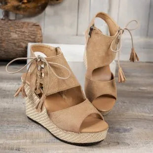 Beige peep-toe wedge sandals with ankle tie laces and tassels, textured wedge platform