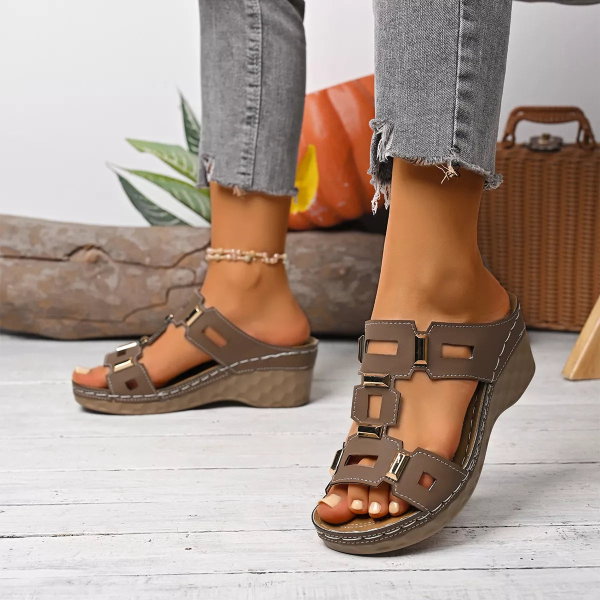 Open-toe wedge sandal in dark brown with two-strap buckle design and open toe