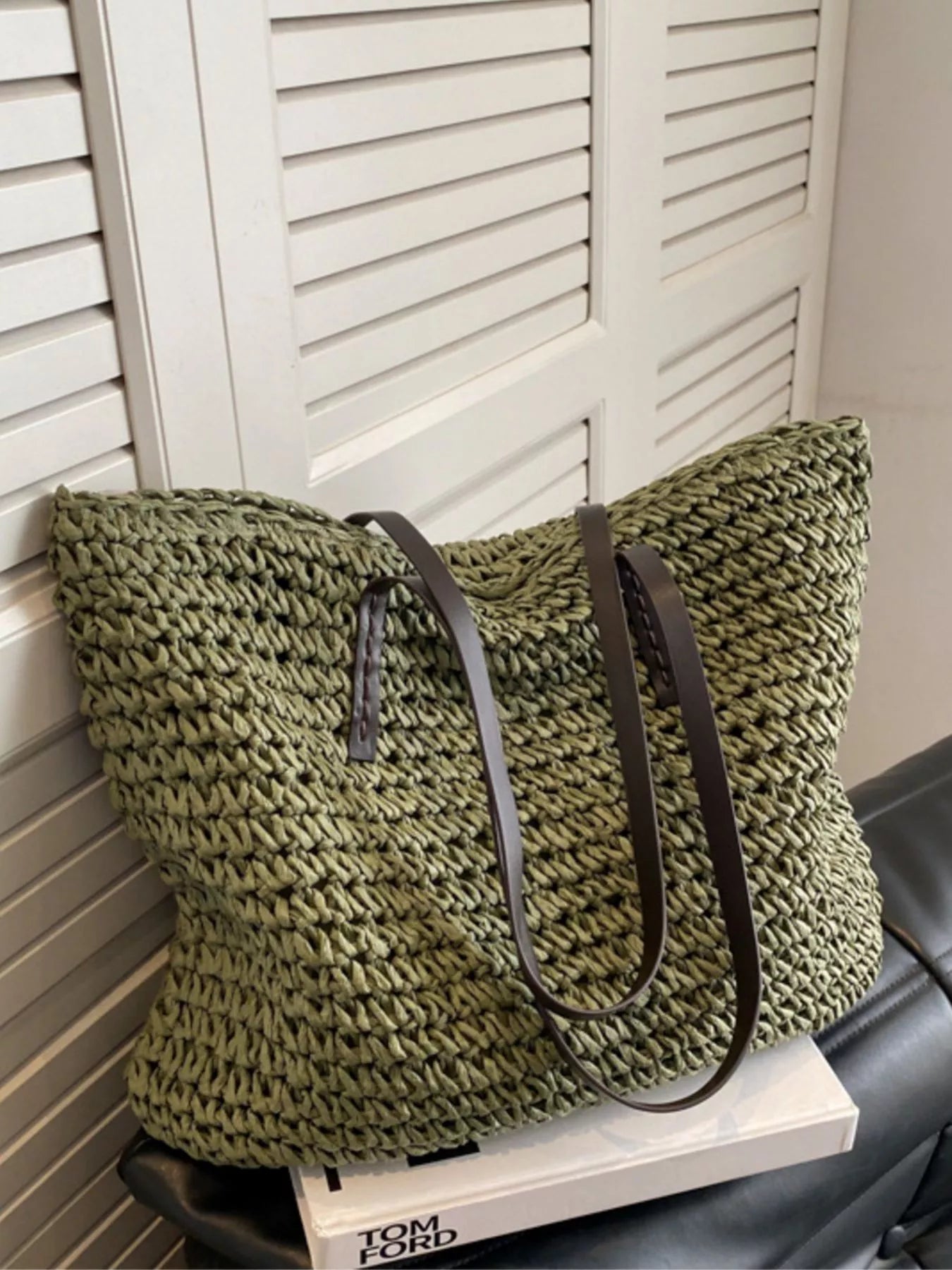 Woven straw shoulder bag with black straps, textured weave basket tote in olive green