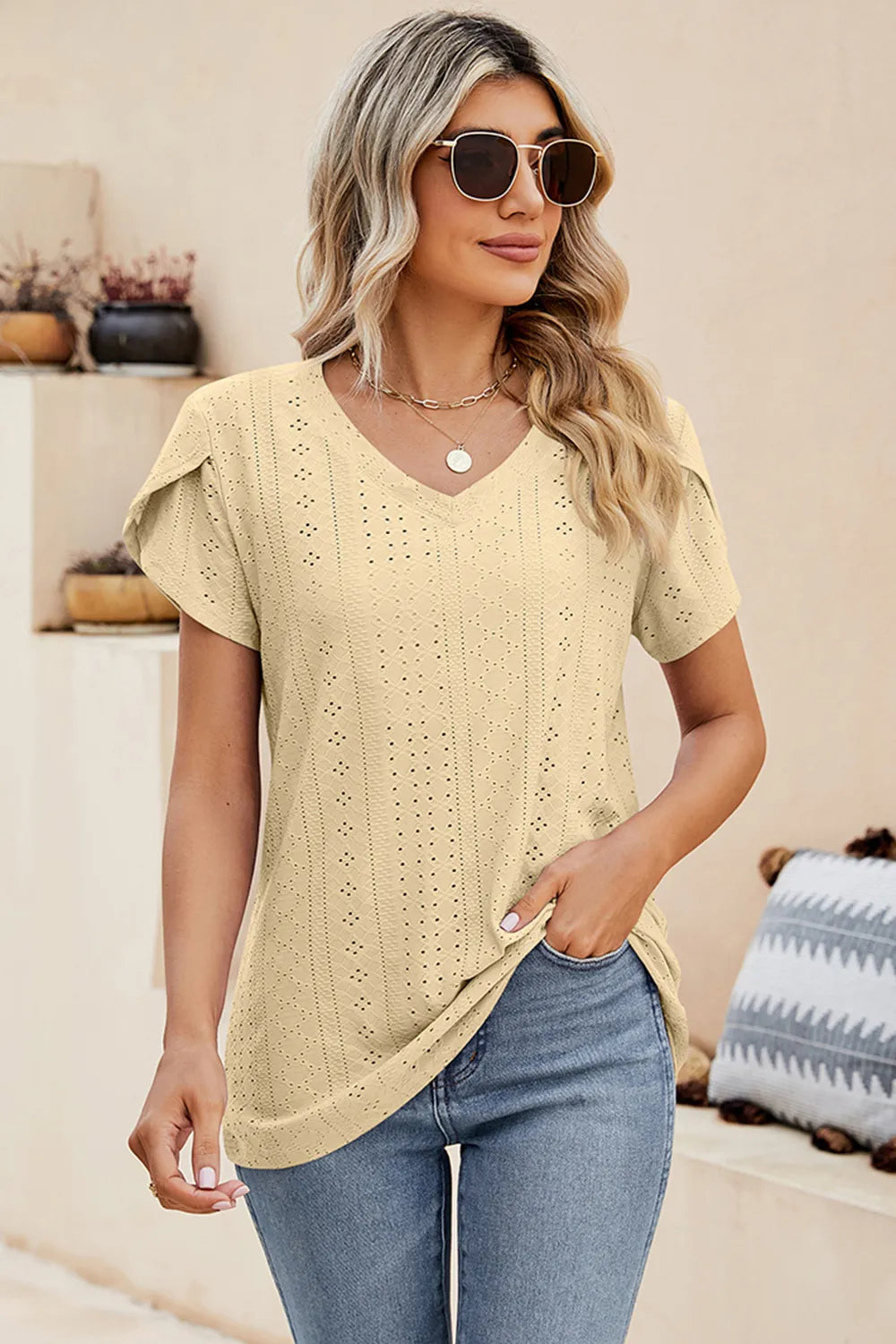 Cream eyelet V-neck petal-sleeve T-shirt with short sleeves and dotted pattern