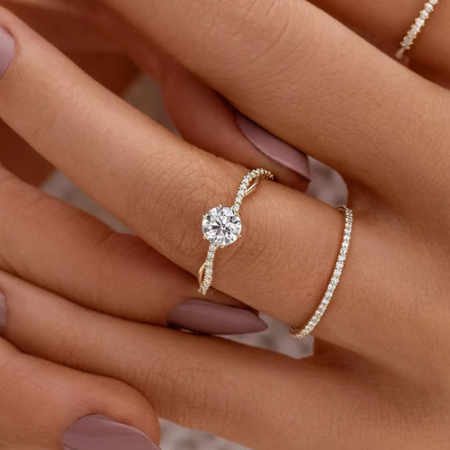 Gold-tone 925 sterling silver zircon ring with round center stone and pavé band