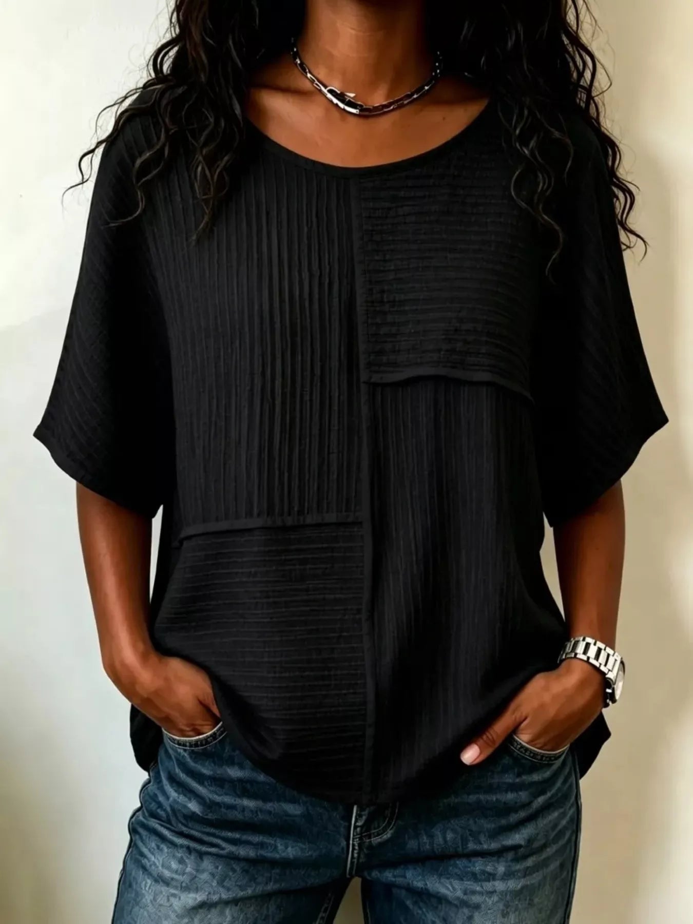 Textured round-neck half-sleeve blouse, black with front patch pockets and button placket