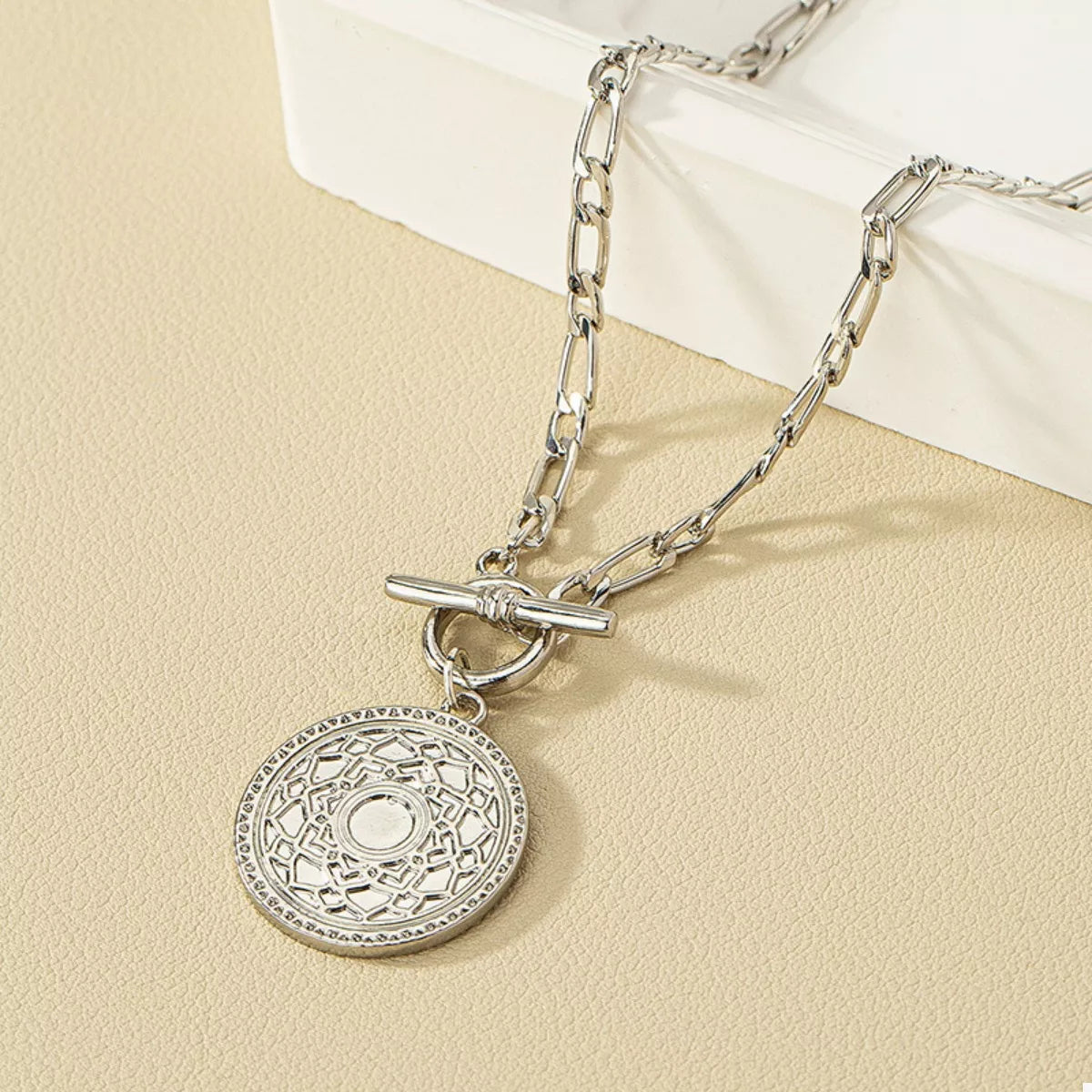 Silver chain necklace with vintage coin pendant charm and toggle bar clasp detail
