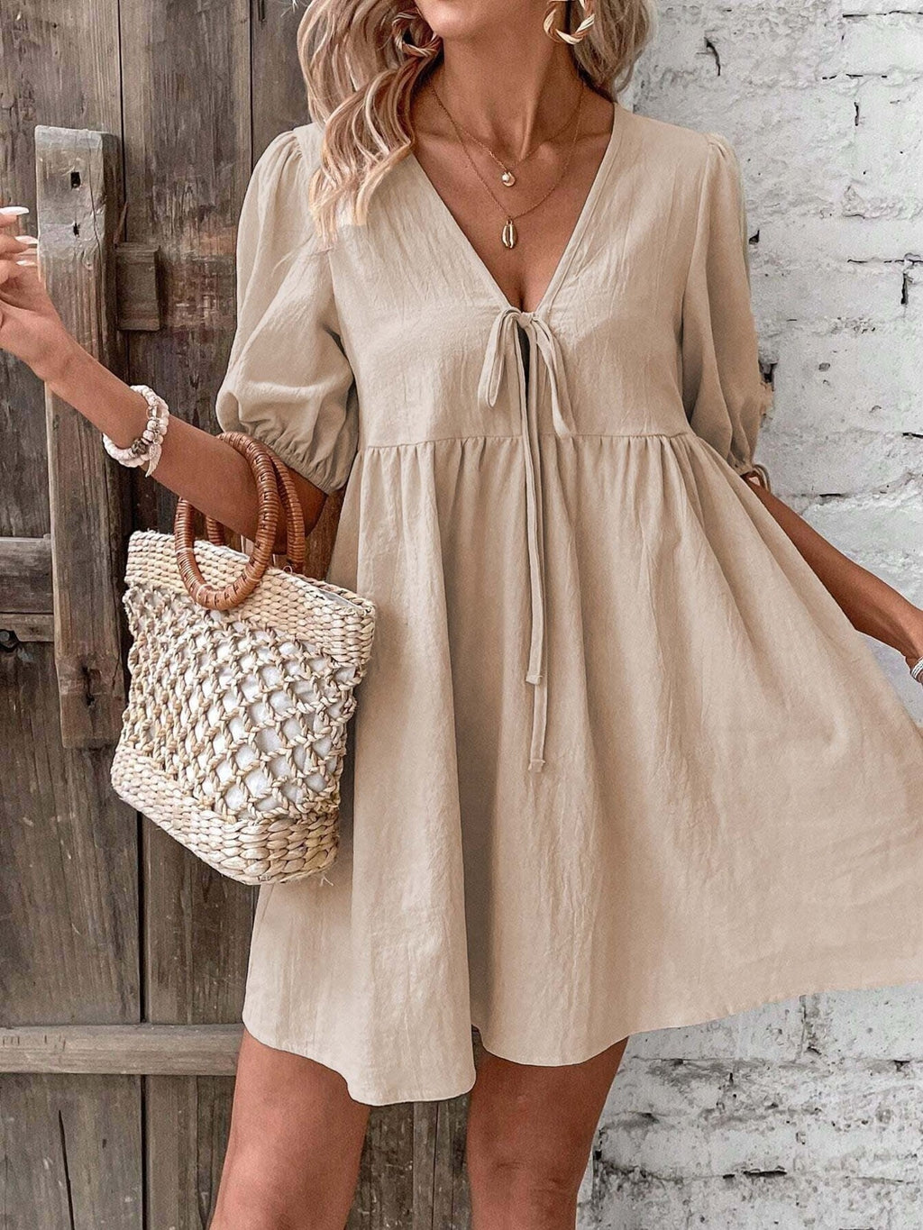 Khaki tie-front V-neck mini dress with puff sleeves and flowy gathered skirt